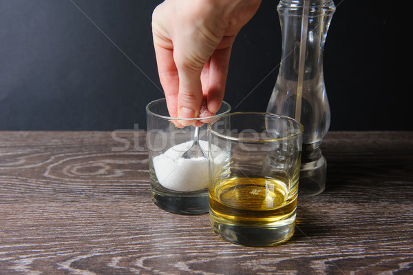 Stock photo: Hand grabbing a pinch of salt