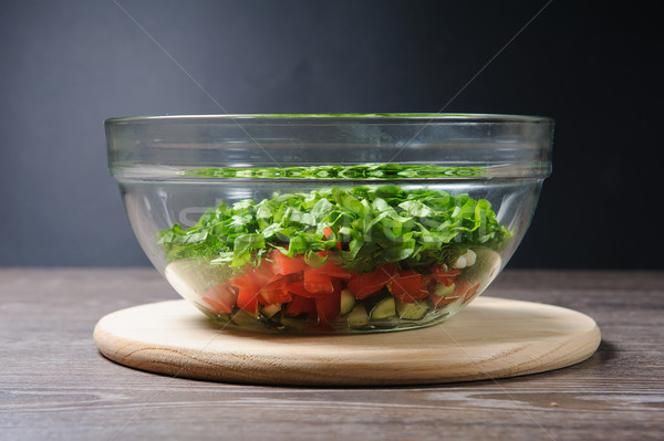 Glass salad bowl on a table Stock photo © O_Lypa