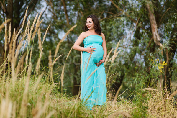 Beautiful pregnant woman outdoors Stock photo © O_Lypa