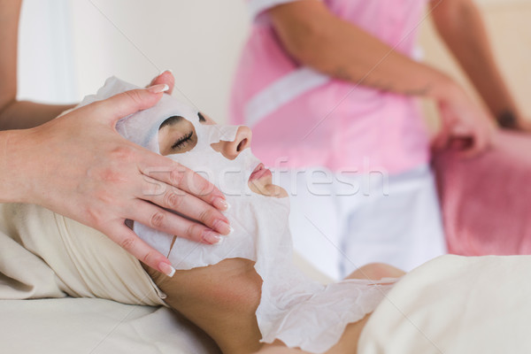 Beautiful woman with facial mask Stock photo © O_Lypa