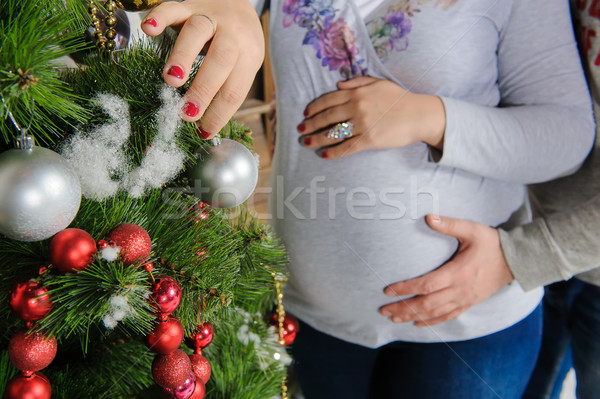 Grávida casal árvore de natal marido esposa Foto stock © O_Lypa