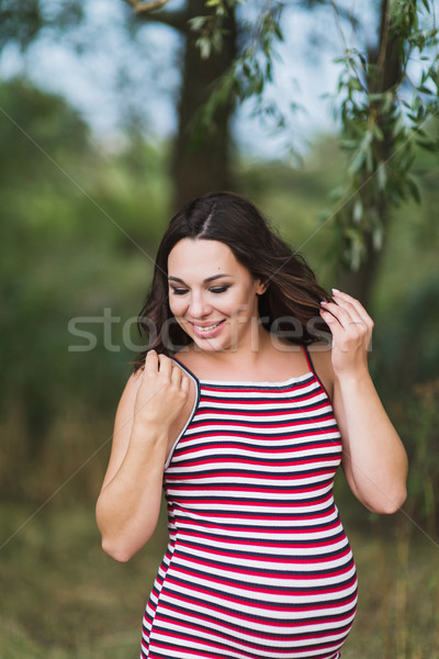 Portrait of a young smiling pregnant woman Stock photo © O_Lypa