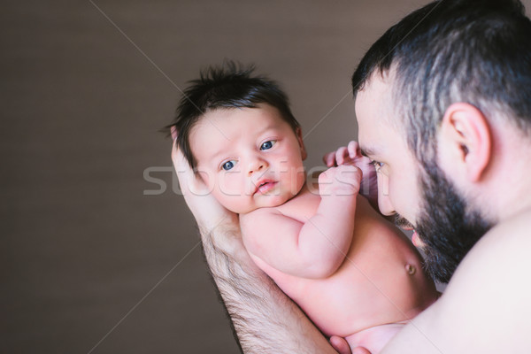 Happy father holding a baby boy Stock photo © O_Lypa