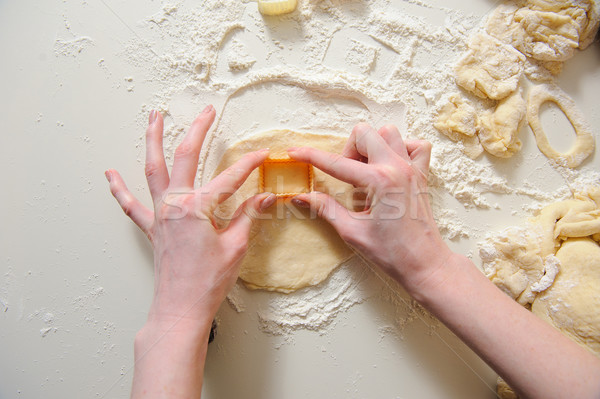 Female hands making cookies from fresh dough Stock photo © O_Lypa