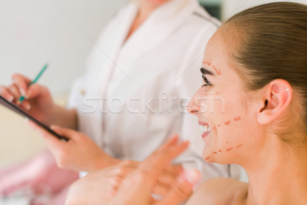 Female patient is talking and smiling with doctor. Stock photo © O_Lypa