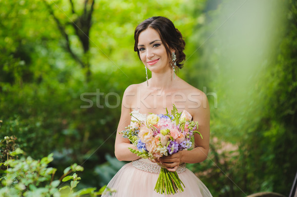 Portrait of a beautiful bride in park Stock photo © O_Lypa