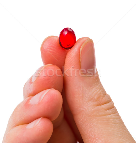 Piros kapszula közelkép fotó kéz orvosi Stock fotó © Obencem