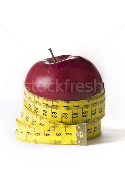 Apple wrapped in tailor tape Stock photo © ocusfocus
