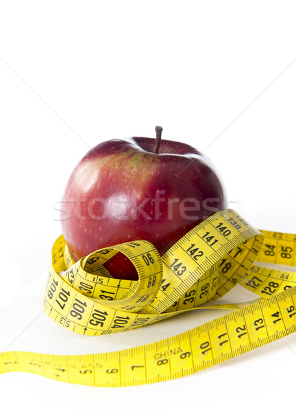 Apple wrapped in tailor tape Stock photo © ocusfocus