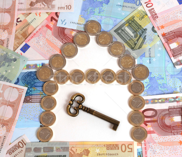 Coins and Banknotes Real State with Key Stock photo © ocusfocus