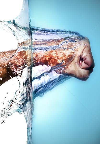 Homme poing eau isolé bleu Photo stock © ocusfocus