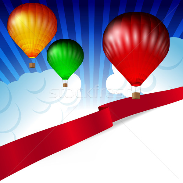 Background white clouds on blue sky and colorful hot air balloon Stock photo © OlgaYakovenko