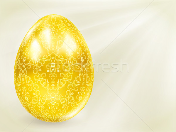 Stock photo: Golden egg in the rays.