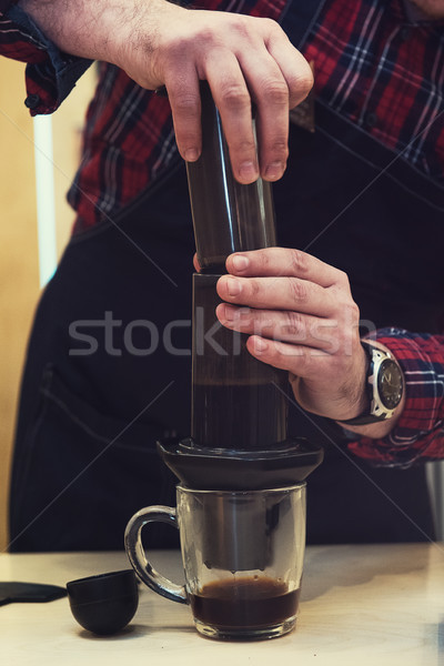 Barista brewing aeropress coffee Stock photo © olira