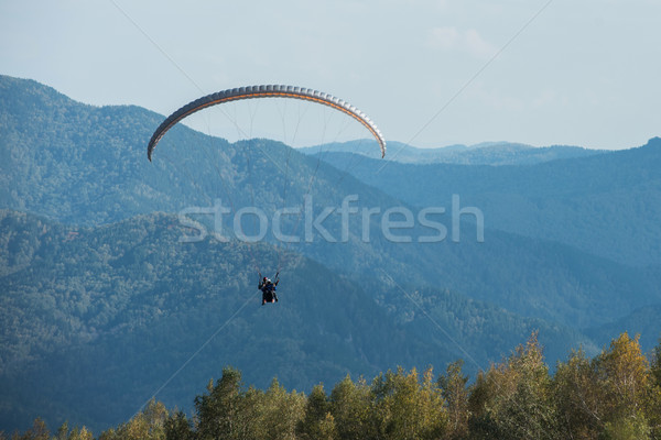 Paragliding in mountains Stock photo © olira