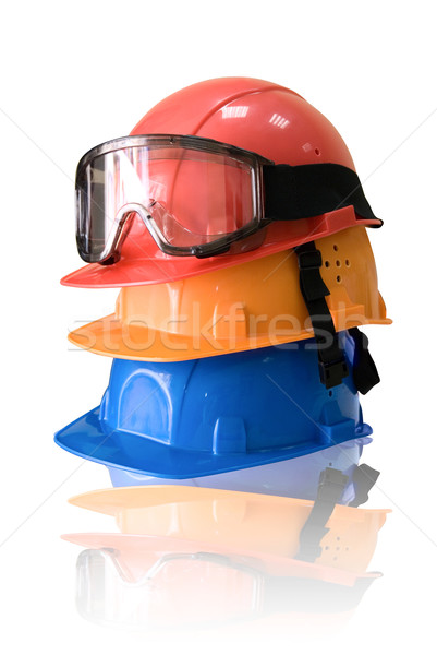 Many colored hardhats and goggles Stock photo © olira