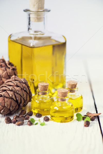 The cedar oil in a glass bottle Stock photo © olira
