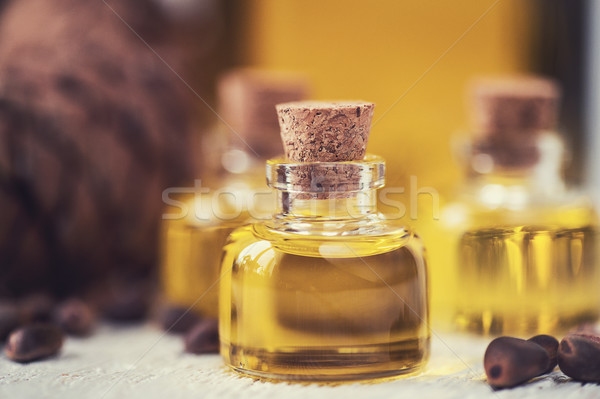 The cedar oil in a glass bottle Stock photo © olira