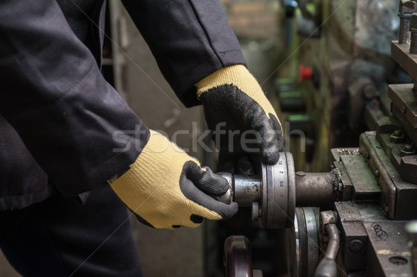 worker in protective gloves Stock photo © olira