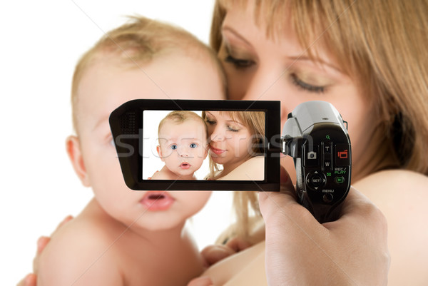 mother with her baby boy at camcorder Stock photo © olira