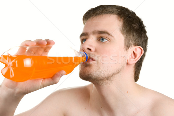 Man drinking orange juice  Stock photo © olira