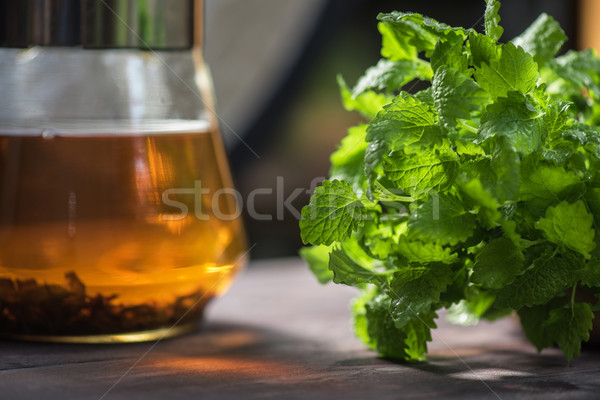 Tea with green fresh melissa  Stock photo © olira