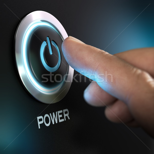 Stock photo: Finger Pressing Power Button on a Computer