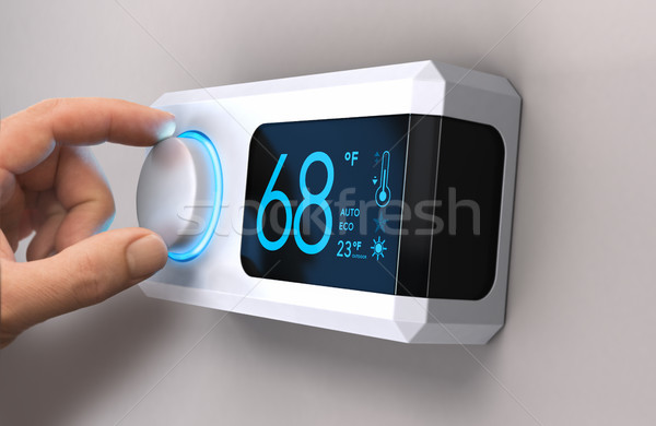 Thermostat home Energie Speichern Hand Knopf Stock foto © olivier_le_moal