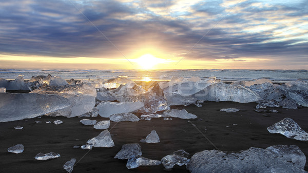 Iceberg playa Islandia puesta de sol glaciar paisaje Foto stock © ollietaylorphotograp