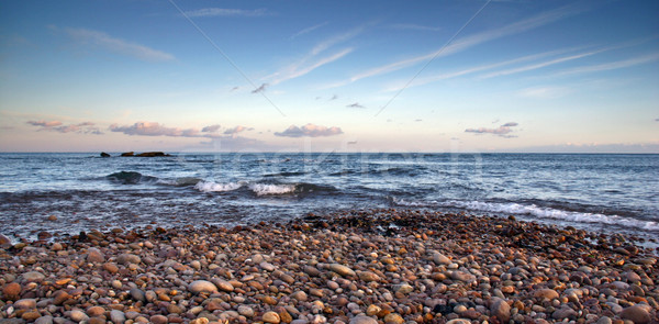 Spiaggia tramonto vibrante cielo acqua panorama Foto d'archivio © ollietaylorphotograp