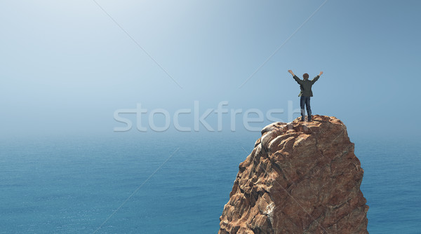 Człowiek stałego górę rock Urwisko ręce Zdjęcia stock © orla