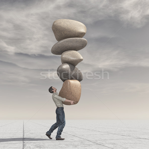 Young man up a pile of stones in balance Stock photo © orla