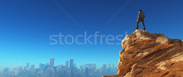 Young man at the top of the stone  Stock photo © orla