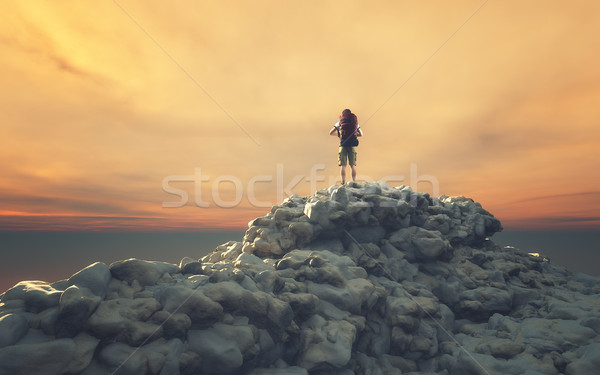 Man with backpack on a rock  Stock photo © orla