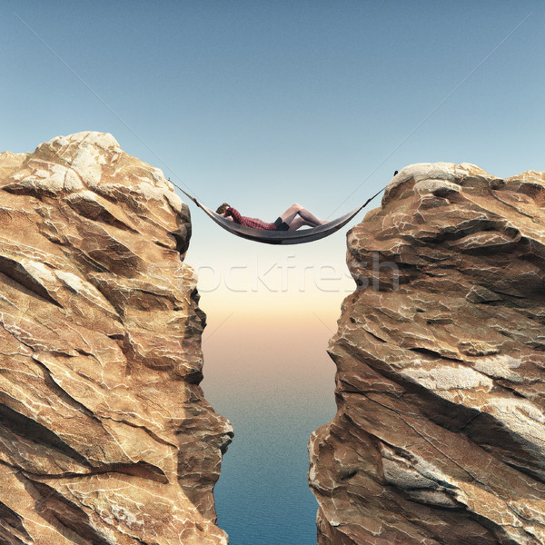 Young man relaxes in a hammock  Stock photo © orla