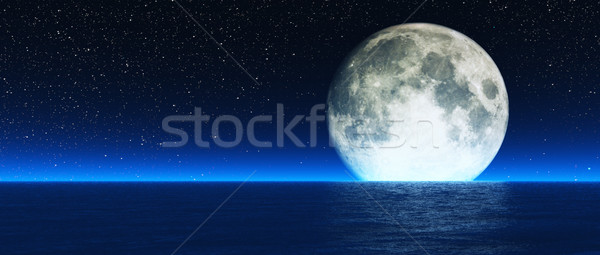 Stock photo: Rising moon over sea.