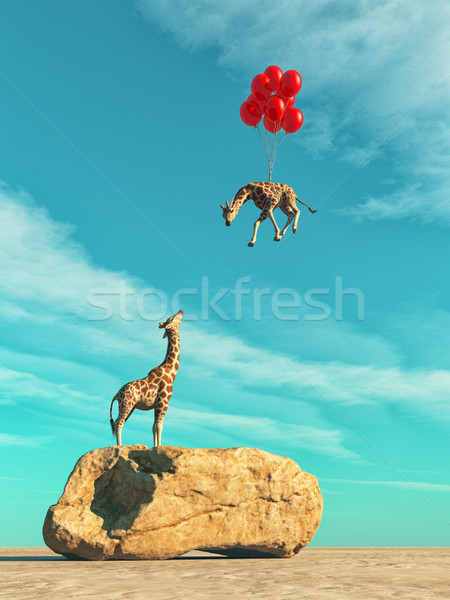 A giraffe standing on a large rock Stock photo © orla