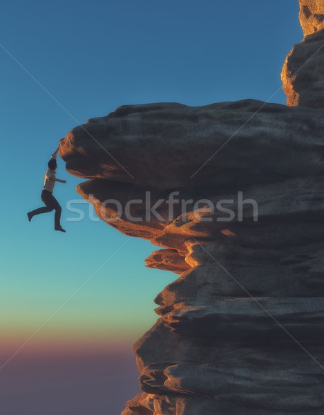 Young man hanging from a cliff Stock photo © orla