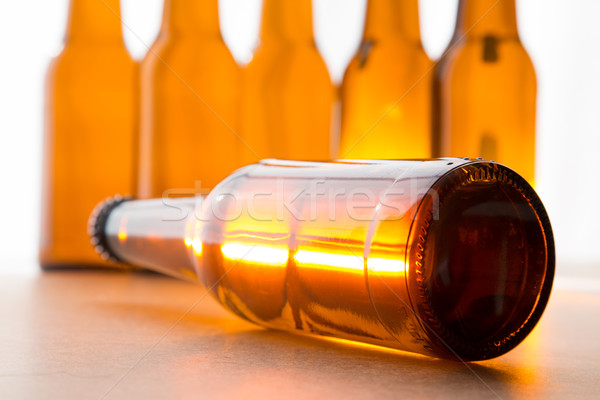 Fényes sörösüveg fekszik több üvegek buli Stock fotó © ottoduplessis