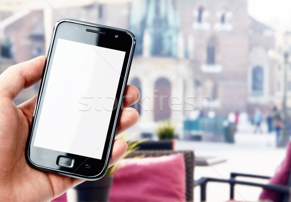 Stockfoto: Hand · smartphone · stad · cafe · scherm