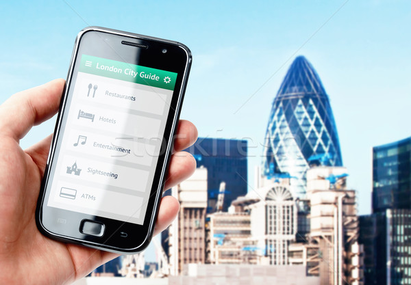Hand halten Smartphone Stadt führen London Stock foto © pab_map