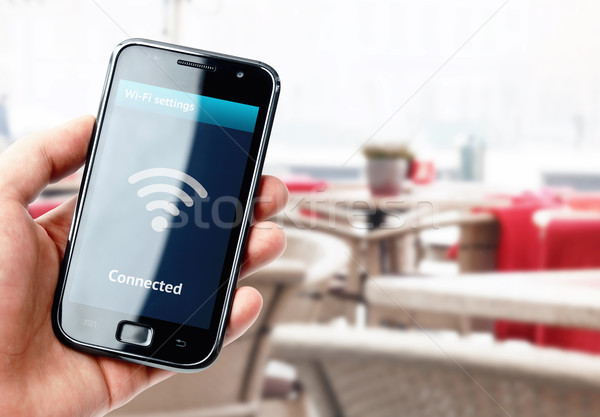 Stock foto: Hand · halten · Smartphone · wifi · Verbindung · Kaffeehaus