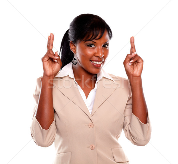 Young executive woman crossing fingers Stock photo © pablocalvog