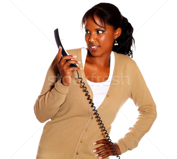 Surprised young woman looking to phone handset Stock photo © pablocalvog