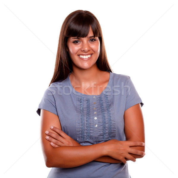 Smiling young woman on blue shirt looking at you Stock photo © pablocalvog