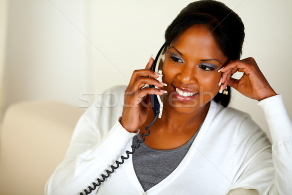 Stock photo: Afro-american female conversing on phone