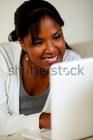 Mosolyog afroamerikai nő néz laptop képernyő portré Stock fotó © pablocalvog