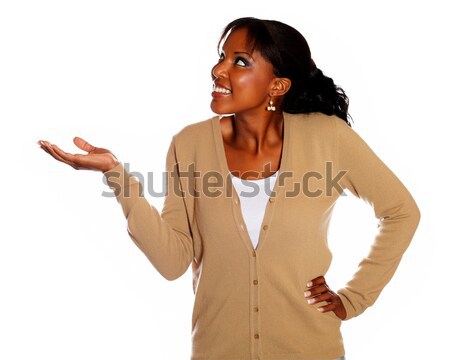 Smiling young woman with extended hand Stock photo © pablocalvog