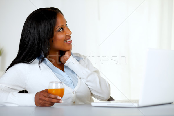 Bastante mulher jovem suco de laranja retrato Foto stock © pablocalvog