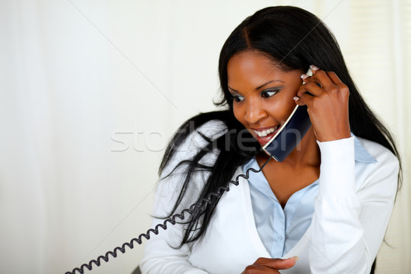 Young lovely girl conversing on phone Stock photo © pablocalvog